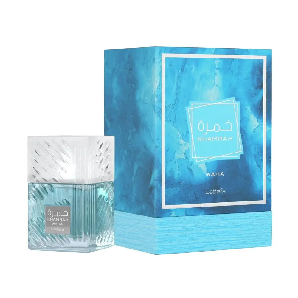 A bottle of Lailafo Waha Khamrah perfume next to its blue marbled packaging box, featuring Arabic text and a light blue textured base, on a solid white background.