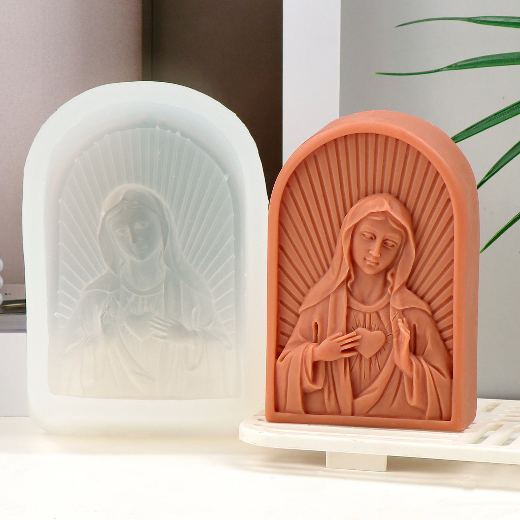Peach Sacred Heart Virgin Mary relief casting beside its white arched silicone mold