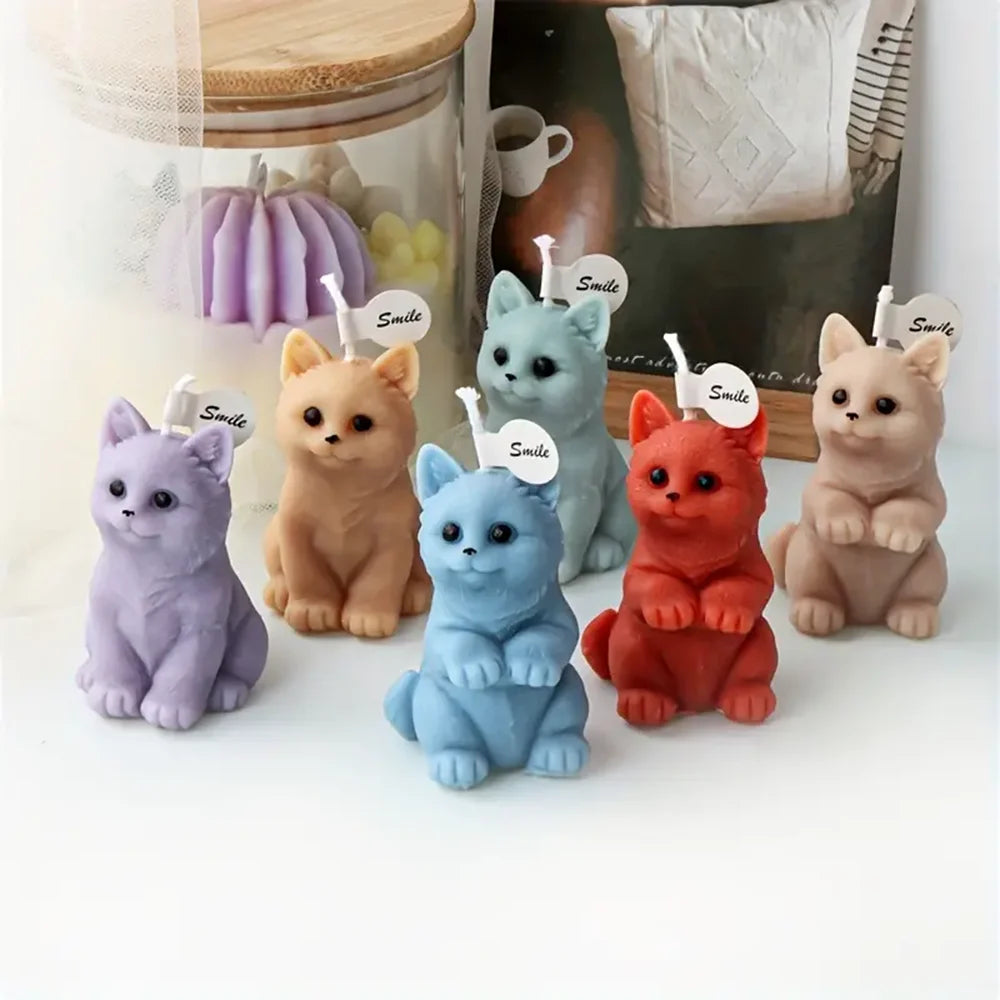 Six pastel and red kitten example candles with seated and upright paw-raised poses