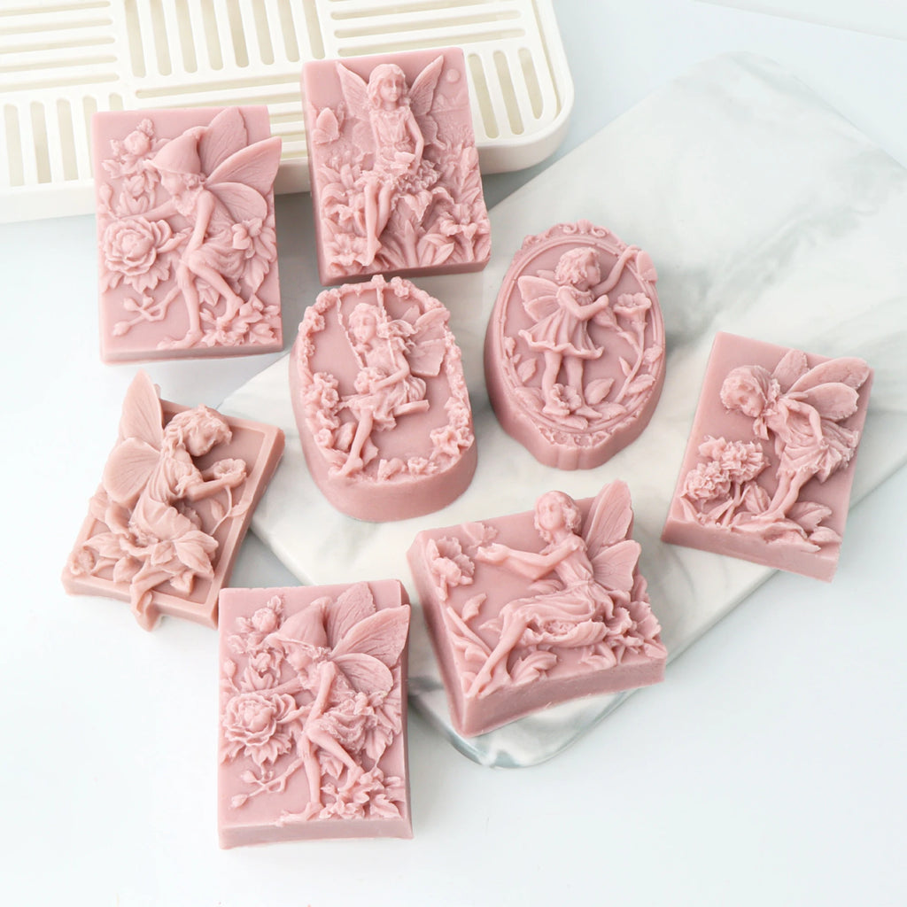 Pink fairy relief soap casting examples in rectangular and oval shapes with flowers and butterfly wings