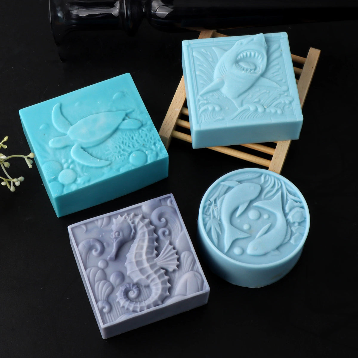 Sea-animal soap casting examples with turtle, shark, seahorse and paired-dolphin relief designs