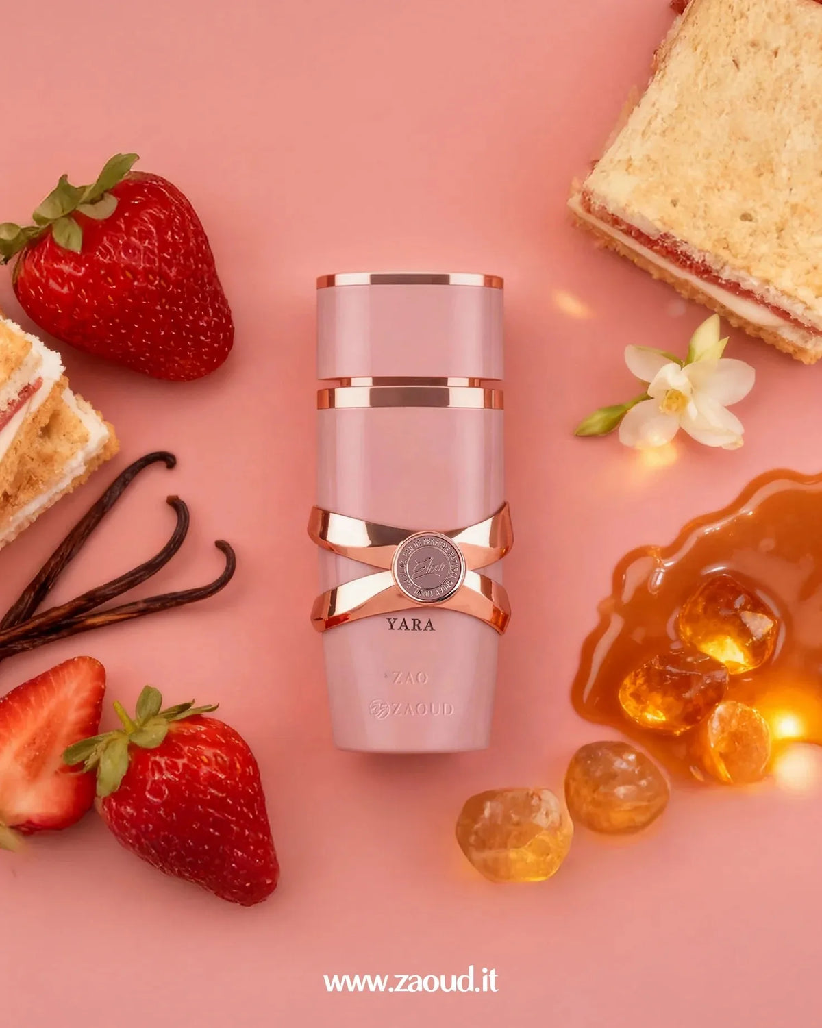Lattafa Perfume with strawberries, vanilla beans, and honey on a pink background