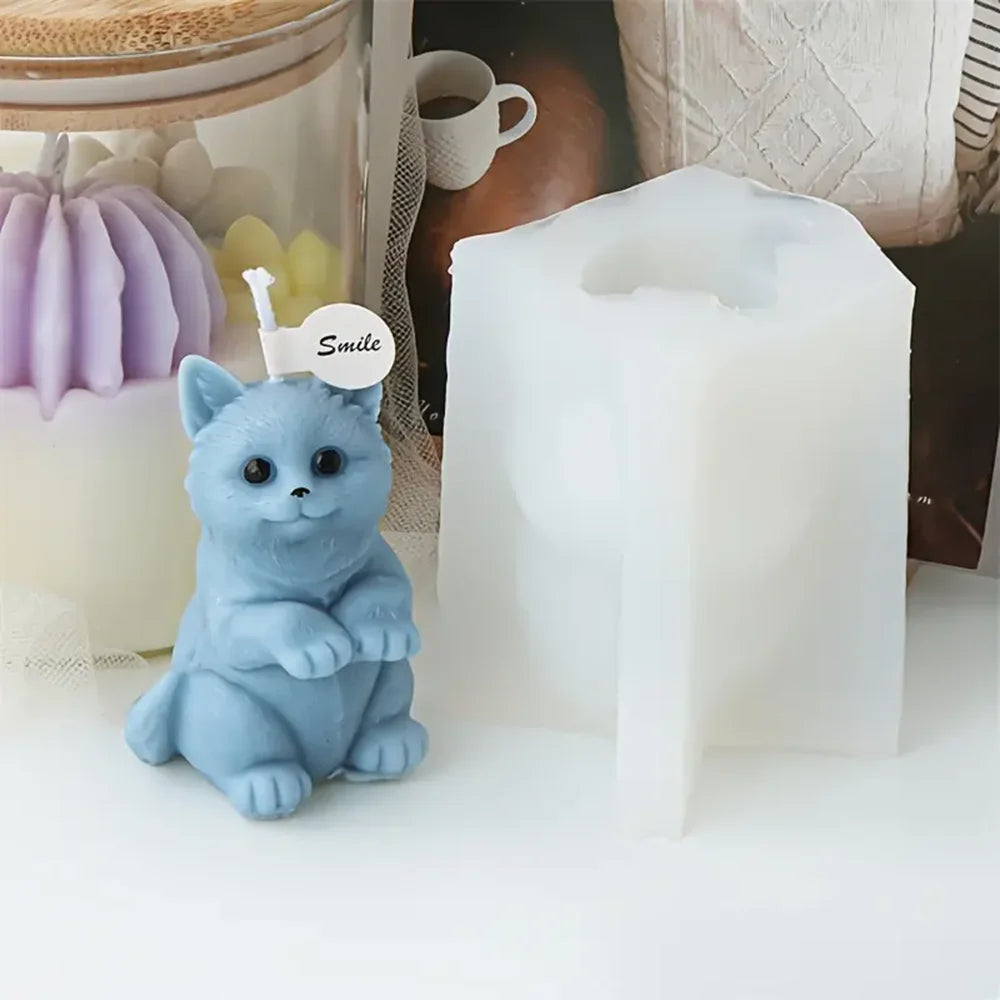 Blue upright kitten example candle beside its white silicone mold
