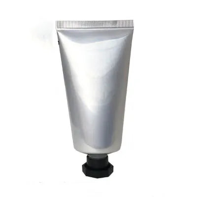 Silver squeeze tube with a black faceted screw cap, style 3