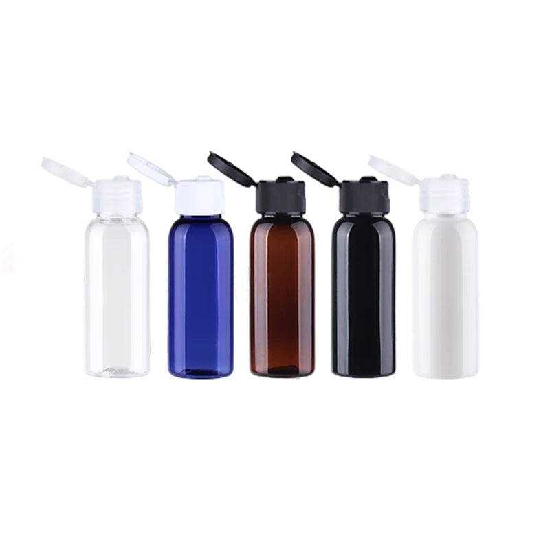 Clear, blue, brown, black and white empty mini bottles with open flip-top caps