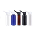 Clear, blue, brown, black and white empty mini bottles with open flip-top caps