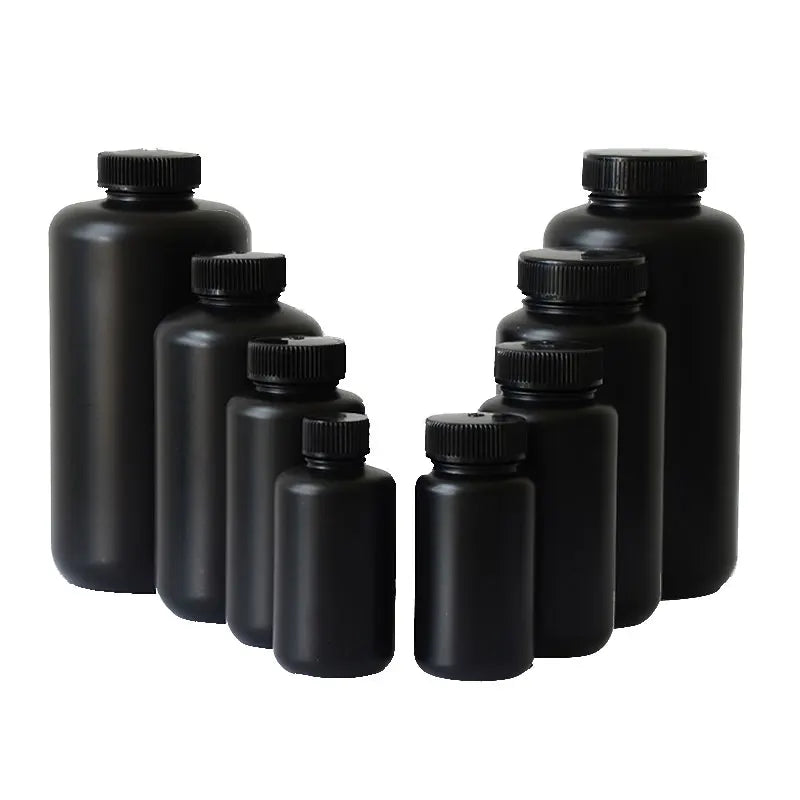 Black wide-mouth HDPE screw-cap bottles arranged in increasing sizes