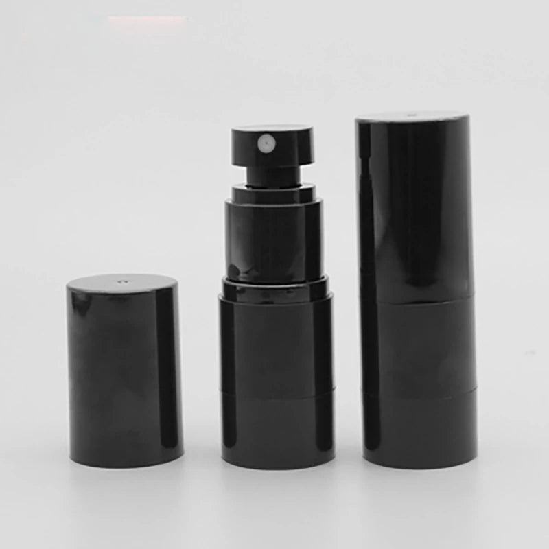 Black spray bottle with cover removed beside a capped bottle