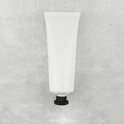 White squeeze tube with small black cap, style 1