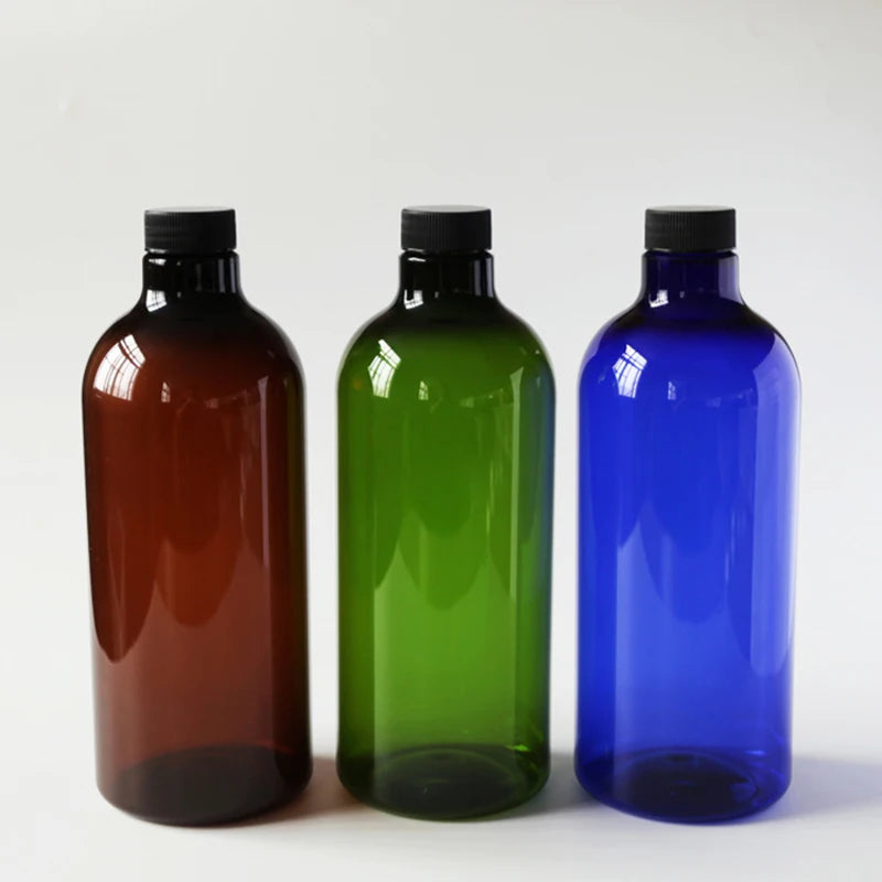 Brown, green and blue PET bottles with black screw caps