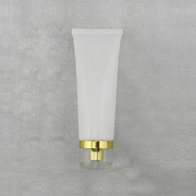 White squeeze tube with gold-tone dispensing closure, style 6