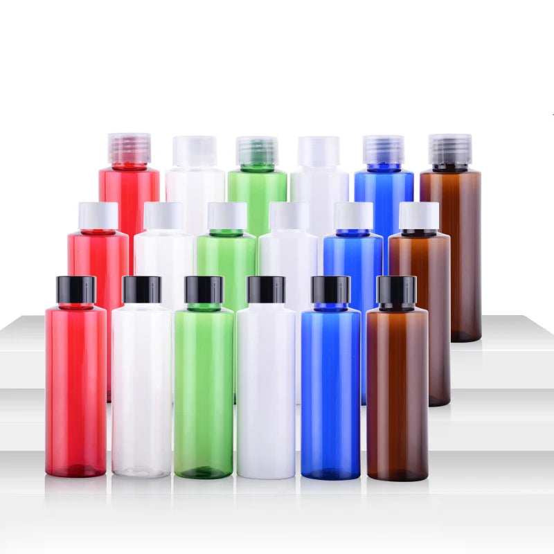 Straight red, white, green, blue and brown bottles with clear, white and black screw caps