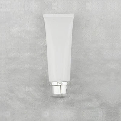 White squeeze tube with stepped silver-tone cap, style 4