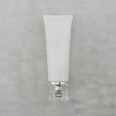 White squeeze tube with silver-tone dispensing closure and clear cover, style 8