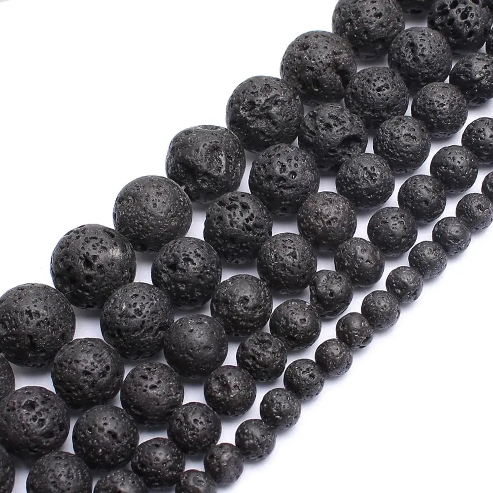 String of dark gray volcanic beads on a white background