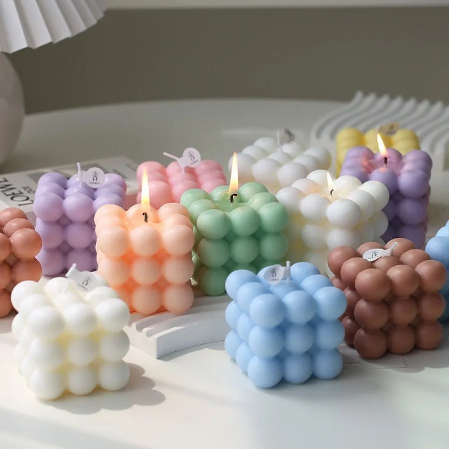 Bubble cube candles in assorted colors with rounded textured sides