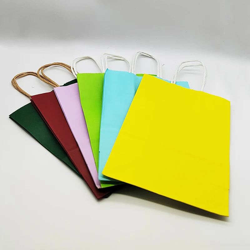 Set of colorful gift bags with handles on a white background