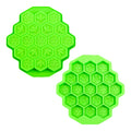 Two views of a green multi-cavity silicone mold with alternating bee and honeycomb hexagons