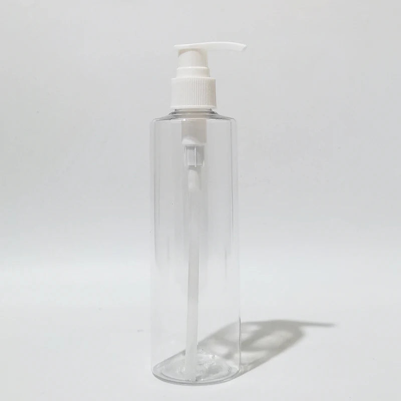 Clear round PET bottle with white lotion pump and visible dip tube