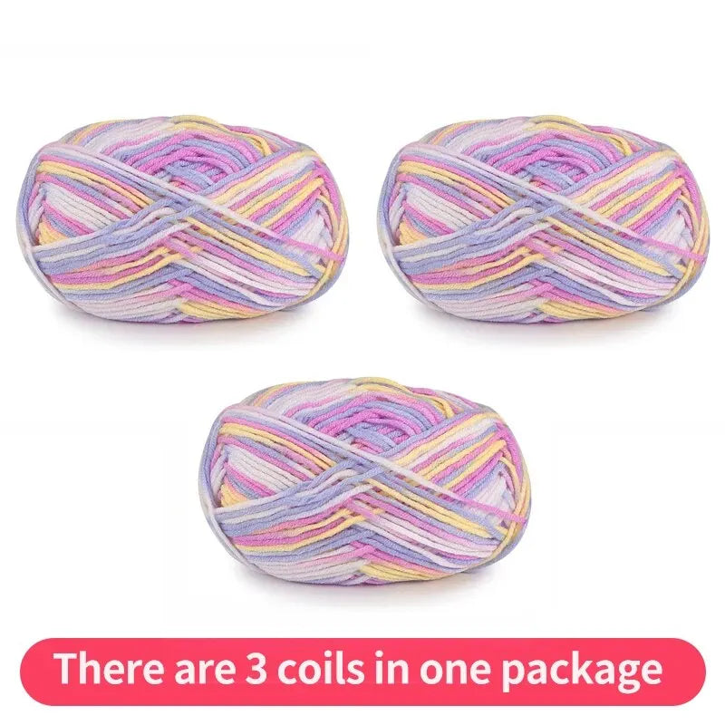 Three pastel yarn skeins in pink, lavender, yellow and white, shown as one package.
