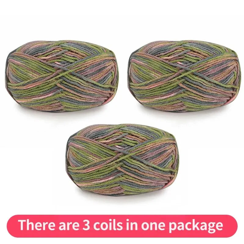 Three muted variegated yarn skeins in olive, gray, peach and mauve, shown as one package.
