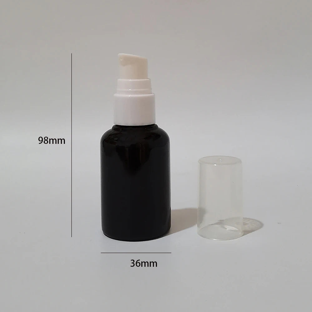 Black empty pump bottle with a white pump, clear cover and dimension diagram