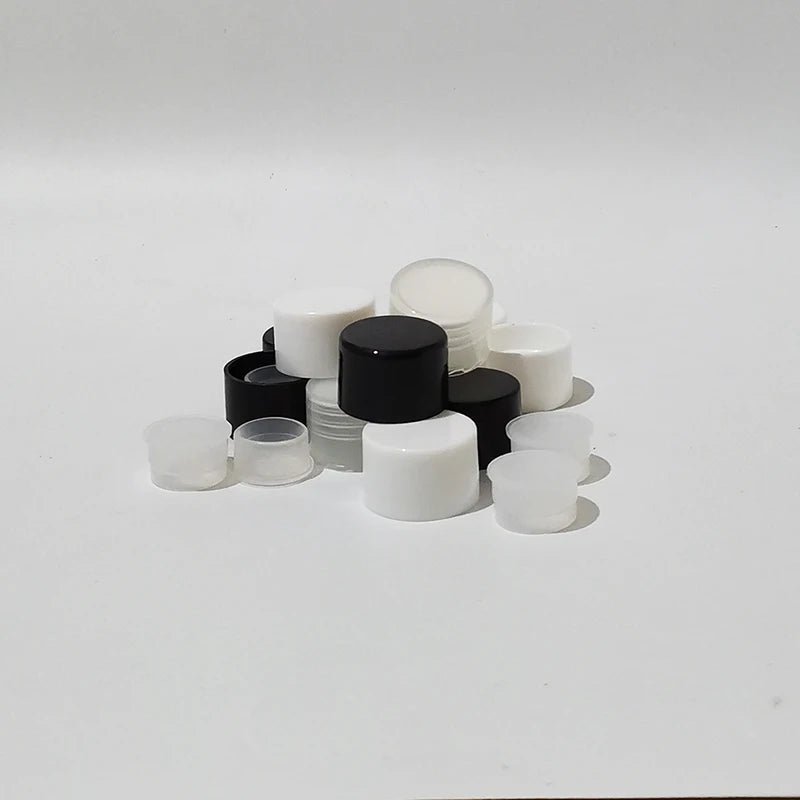 Black, white and translucent screw bottle caps and stopper inserts