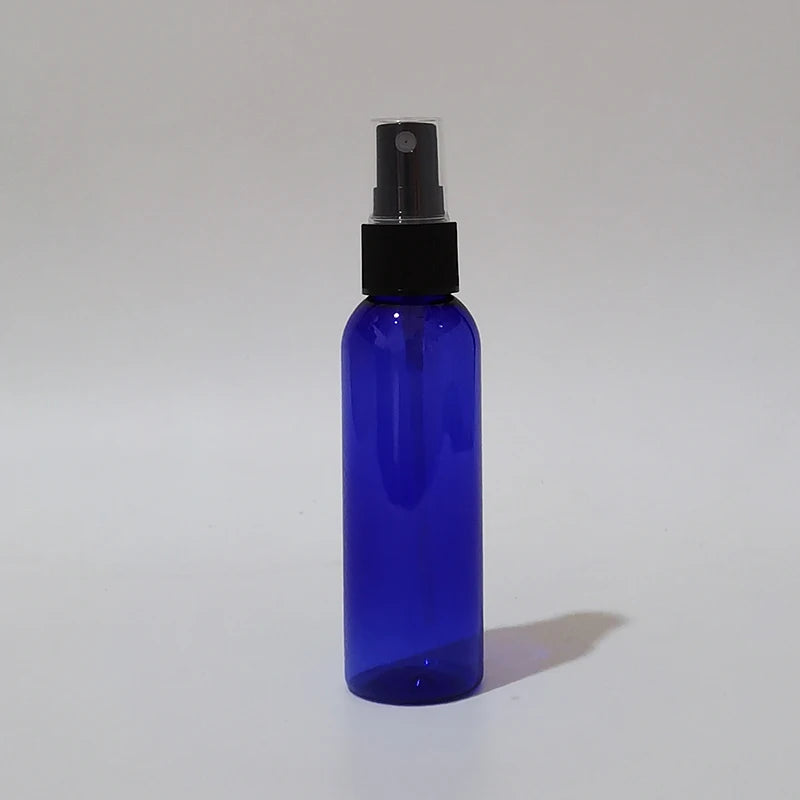 Blue round spray bottle with black sprayer and clear protective cap