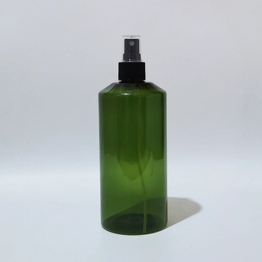 Green PET spray bottle with black sprayer and clear protective cap