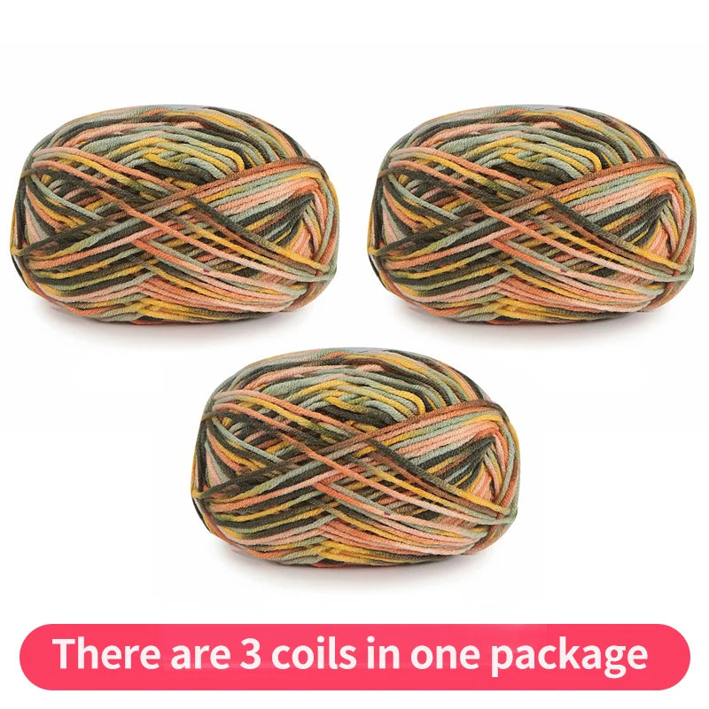 Three variegated yarn skeins in olive, peach, brown and yellow, shown as one package.