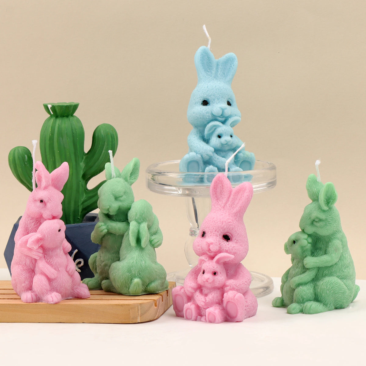 Pink, green and blue rabbit family example candles in three parent-and-young designs