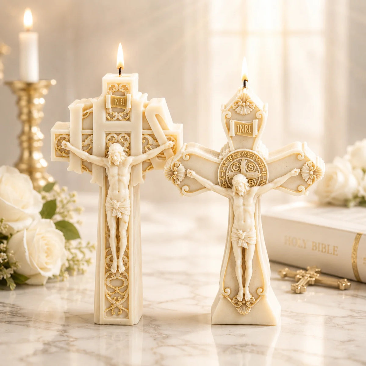 Two lit ivory crucifix example candles with Jesus figures and gold-colored ornamental details