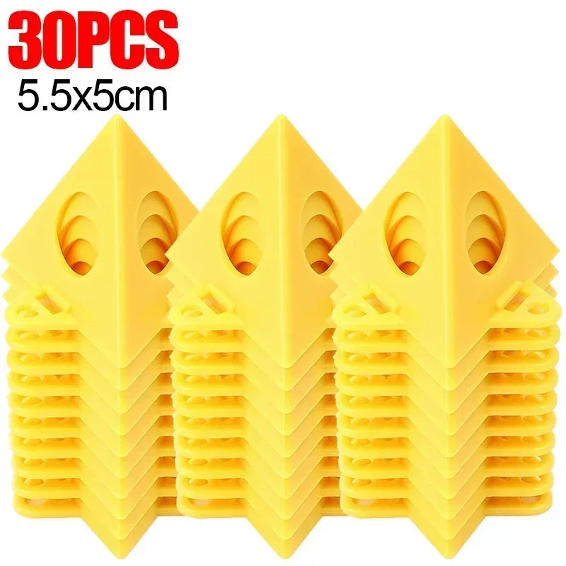 Three stacks of bright yellow plastic wedge-shaped pieces, each stack containing multiple identical pieces, shown on a white background with red text reading '30PCS' and black text reading '5.5x5cm'.