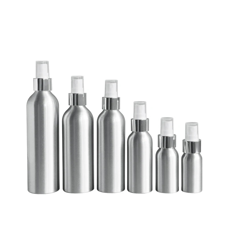Six silver aluminum spray bottles arranged from largest to smallest