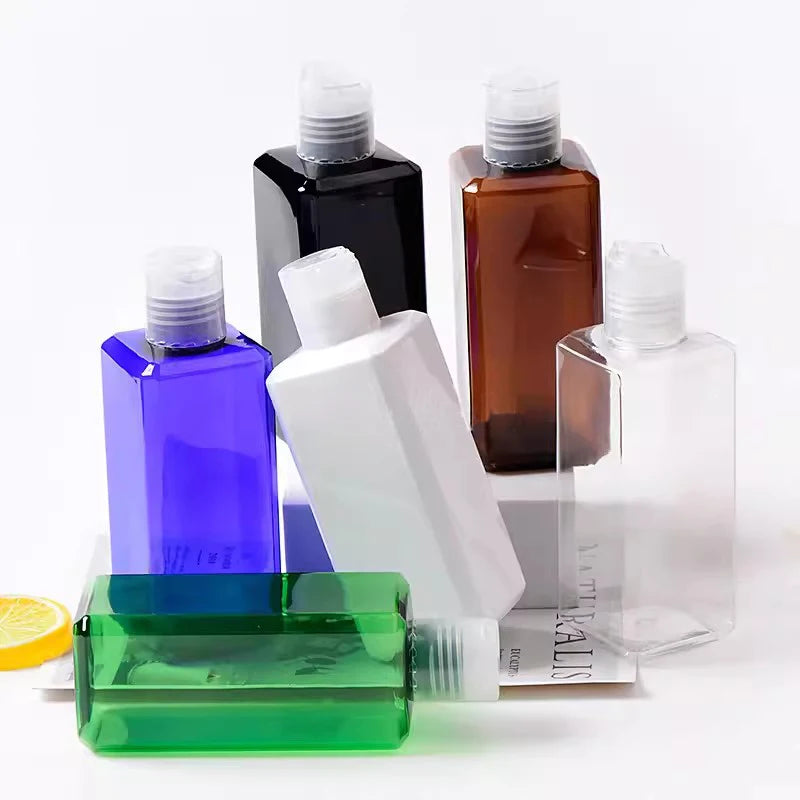 Square bottles in assorted colors with clear disc-top closures