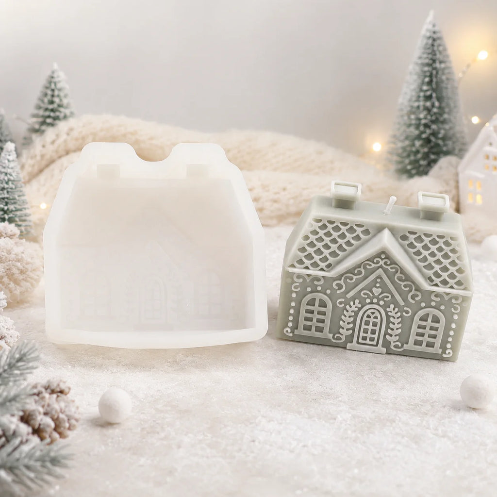 Wide green cottage example candle beside a white silicone mold, showing scalloped roof and arched windows