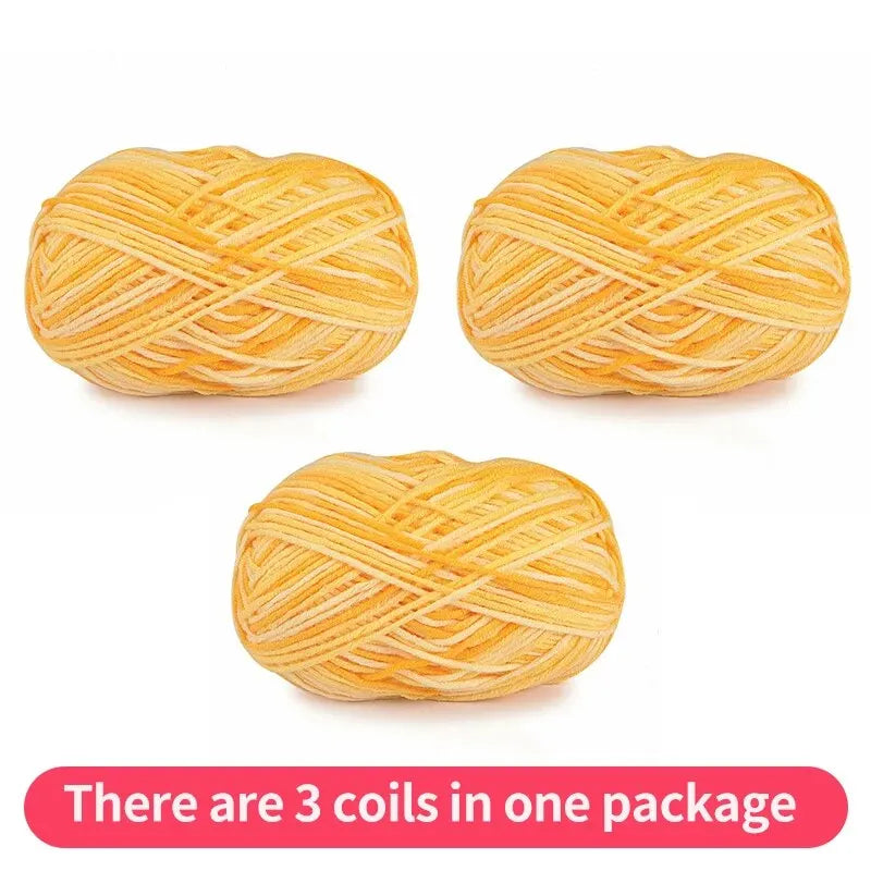 Three golden yellow tonal yarn skeins, shown as one package on a white background.