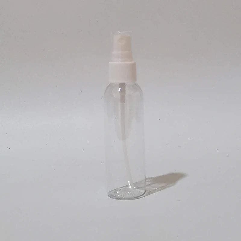 Clear round spray bottle with white sprayer, dip tube and protective cap