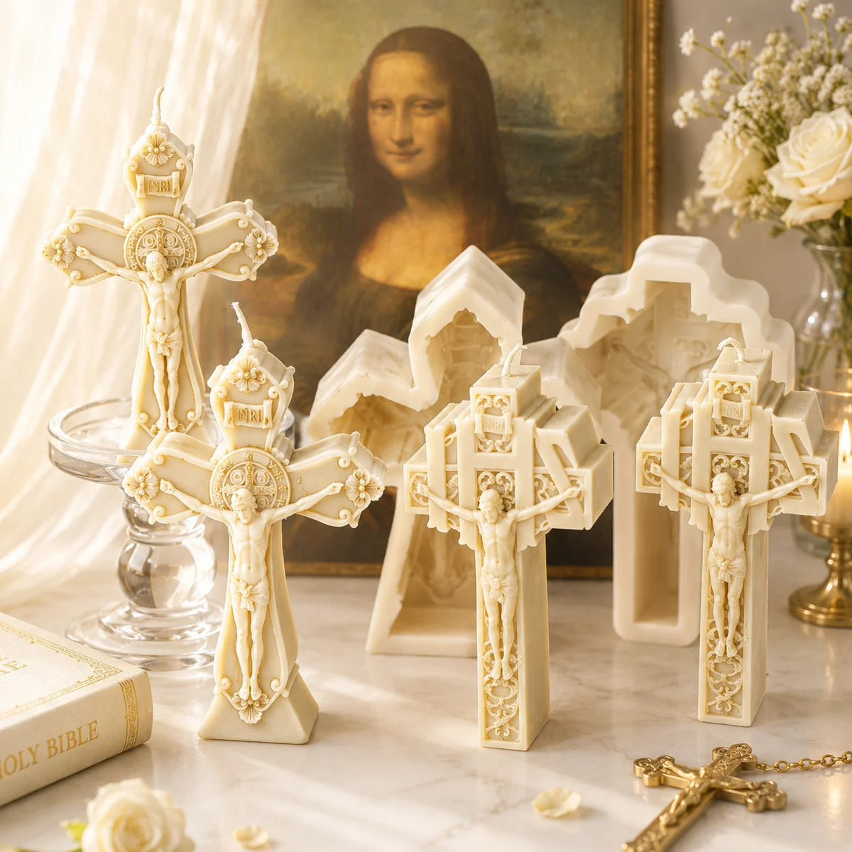 Four ornate crucifix example candles and two white silicone molds beside religious display props