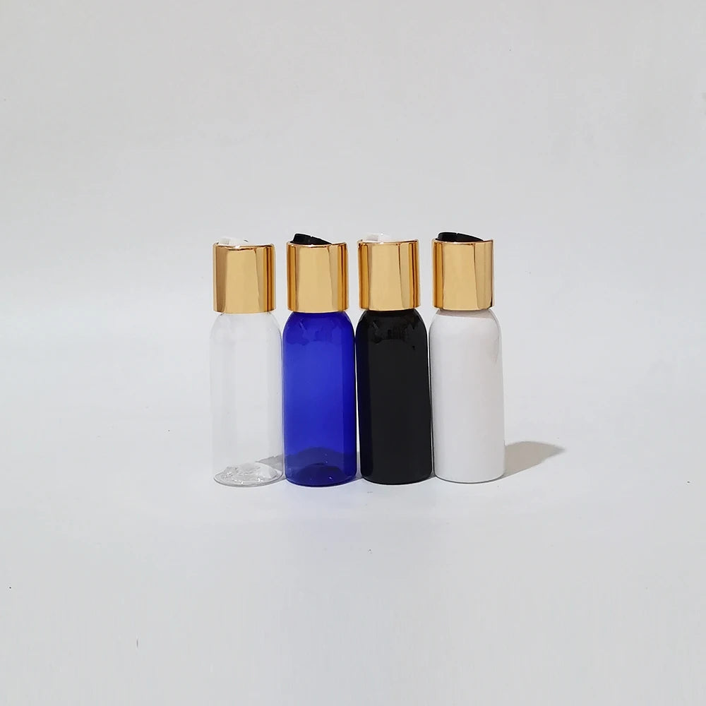 Clear, blue, black and white PET bottles with gold-tone disc caps and black or white inserts