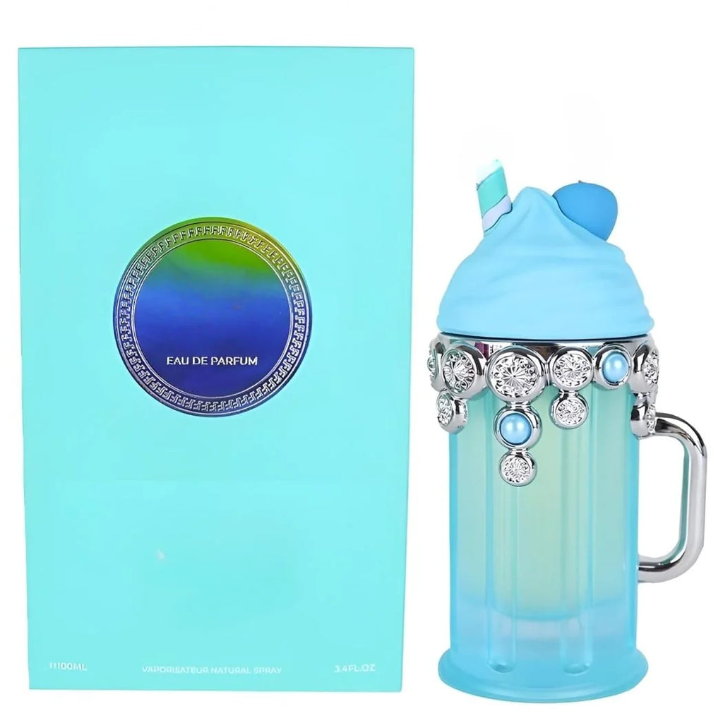 A light blue and green gradient Armaf perfume bottle with a handle, decorated with rhinestones and a blue cap, shown next to its light blue packaging box.