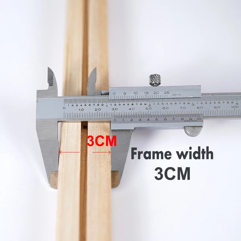 Stretcher bar for canvas with a caliper measuring 3cm frame width on a white background