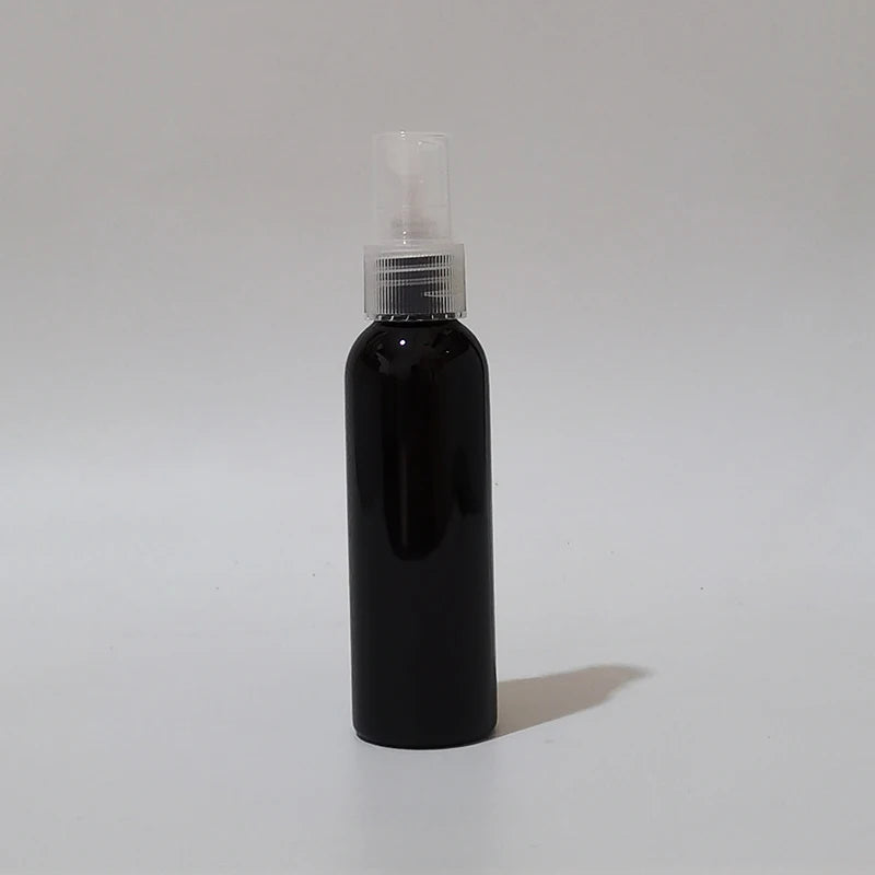 Black round spray bottle with clear sprayer and protective cap