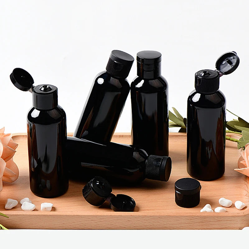 Black PET bottles with black flip-top caps, shown open and closed