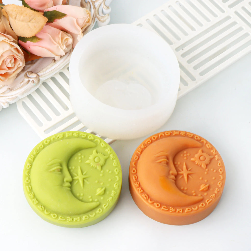 Green and orange crescent-moon face soap examples beside a white round silicone mold