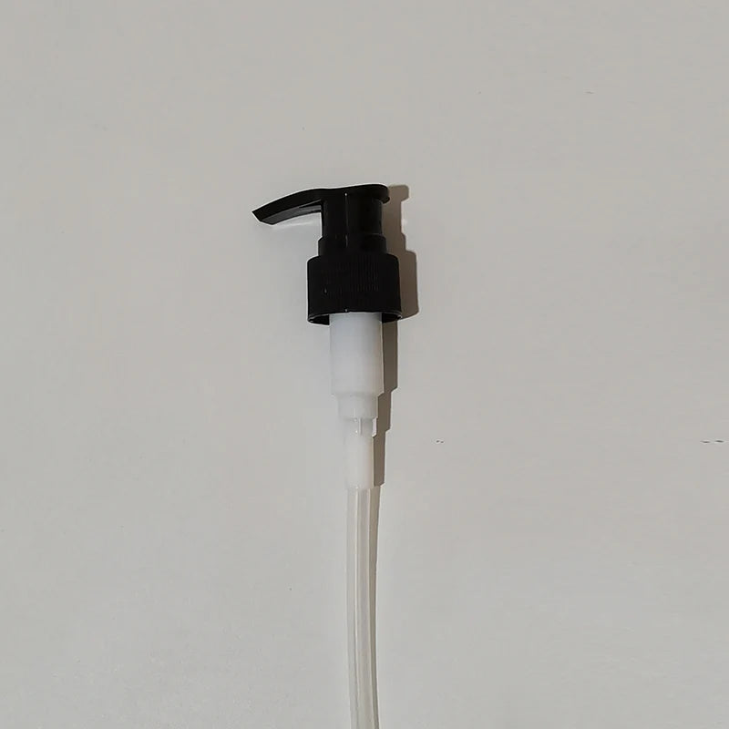 Black lotion pump dispenser with a long clear dip tube