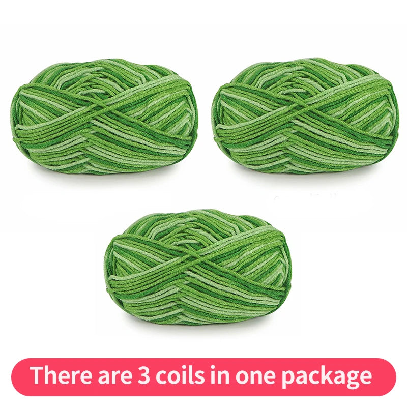 Three green tonal yarn skeins, shown as one package on a white background.