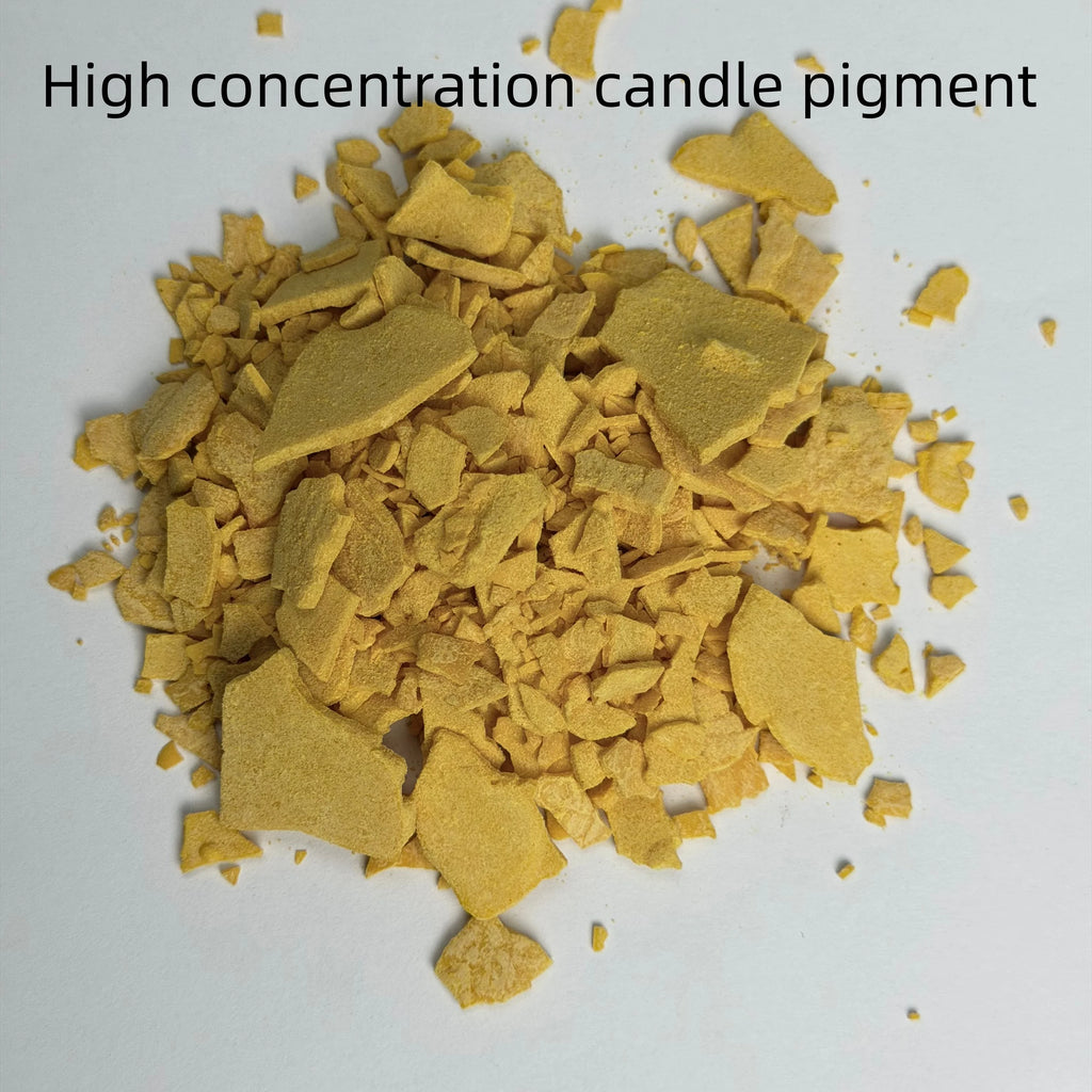 A pile of yellow-brown wax flakes or pigment chips on a white background with the text 'High concentration candle pigment' at the top.