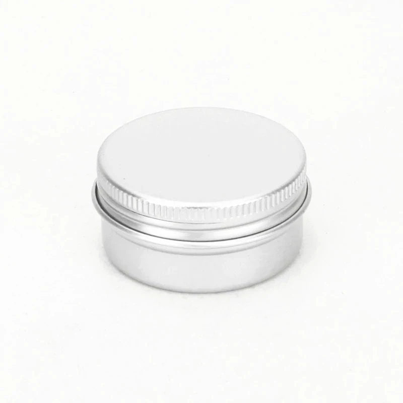 Closed silver aluminum cosmetic tin with ridged screw lid
