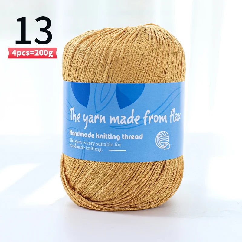 Mustard yellow linen lace yarn skein, color code 13, with a blue flax label.